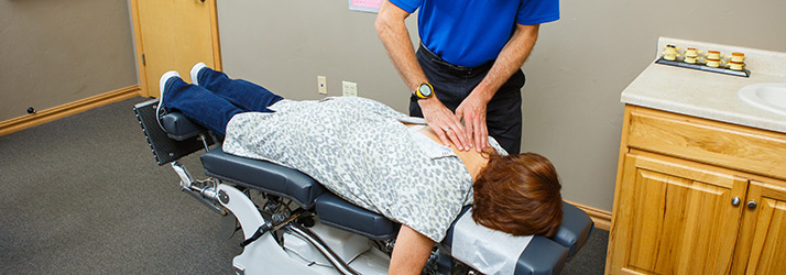 Chiropractor Green Bay WI Christopher Meyer Treating Back Pain